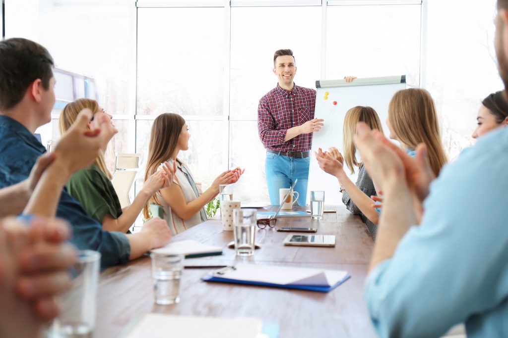 male business trainer giving lecture in office